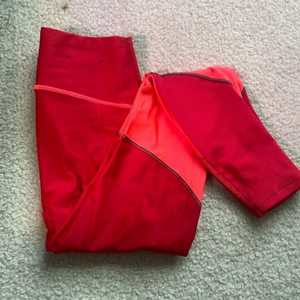 Under Armour XS women’s leggings, bright coral and red